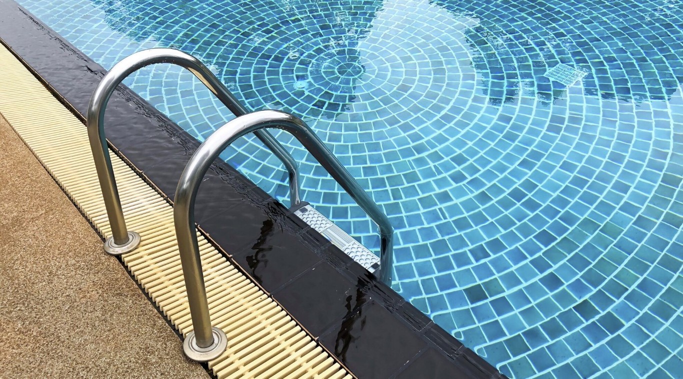 Pool inspection showing mosaic tile and ladder details